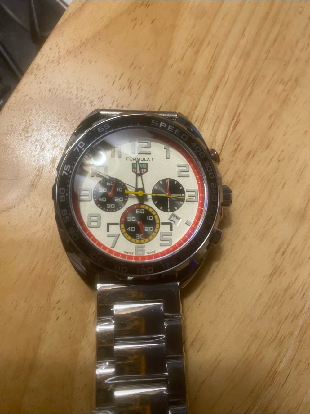 New Tag Heuer Silver Steel Formula 1 Watch with White Dial and Red Accents